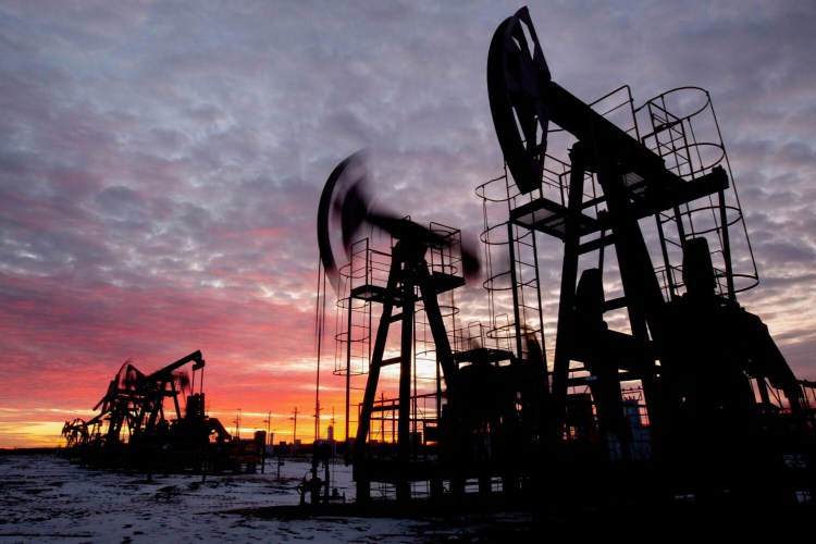 Oil pumping jacks operate in an oilfield near Neftekamsk, in the Republic of Bashkortostan, Russia, on Nov. 19, 2020. MUST CREDIT: Bloomberg photo by Andrey Rudakov