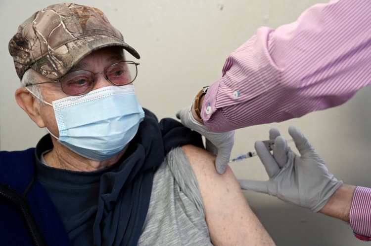 Kenneth Moulton of York receives a vaccination at the clinic at St. Christopher's Church in York on Wednesday. 