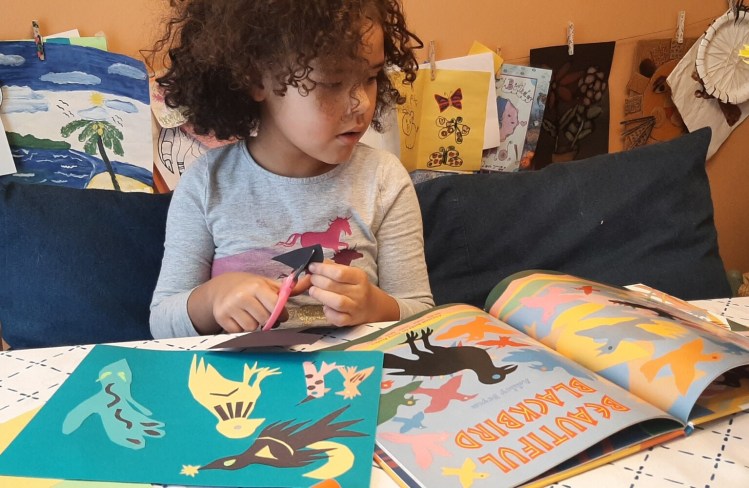 Four-year-old Naomi Shirley creates her Beautiful Blackbird-inspired collage from a special Art Kit for All to celebrate the artwork and legacy of Maine artist Ashley Bryan in honor of Black History Month.