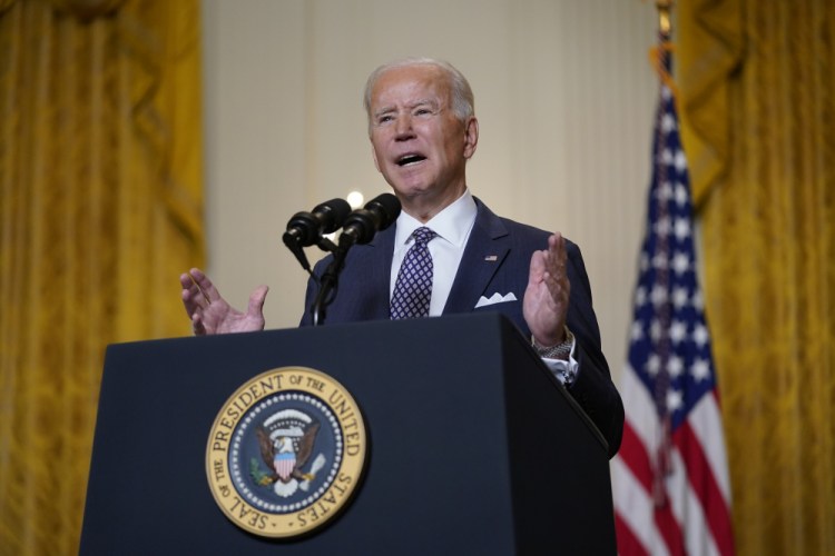 President Biden speaks during a virtual event with the Munich Security Conference in the East Room of the White House on Friday in Washington. “The United States is determined to reengage with Europe, to consult with you, to earn back our position of trusted leadership,” he told world leaders.