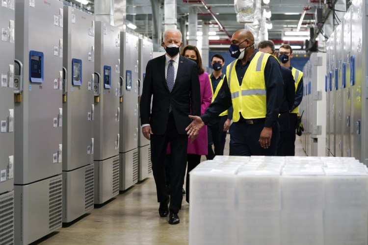 President Joe Biden tours a Pfizer manufacturing site, Friday, Feb. 19, in Portage, Mich. 