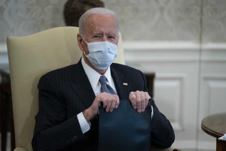 President Biden meets with Senate Majority Leader Sen. Chuck Schumer of New York and other Democratic lawmakers to discuss a coronavirus relief package, in the Oval Office of the White House on Wednesday in Washington. 