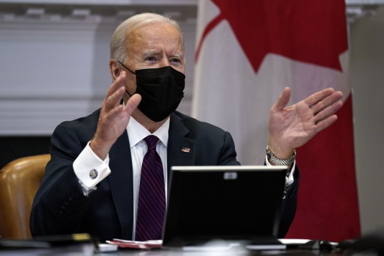 President Biden has asked all Americans to wear face masks for the first 100 days of his term, pointing to models showing it could help save 50,000 lives.