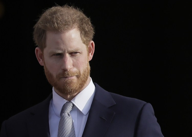 Britain's Prince Harry arrives in the gardens of Buckingham Palace in London in January 2020. Prince Harry has accepted an apology and damages from the publisher of British tabloid The Mail on Sunday and its online version, in a libel lawsuit relating to articles about his relationship with the British armed forces. 