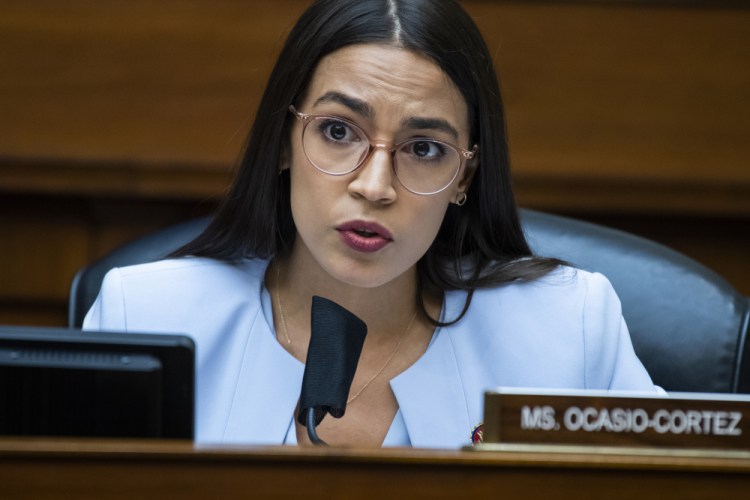 U.S. Rep. Alexandria Ocasio-Cortez, D-N.Y., questions Postmaster General Louis DeJoy during a House Oversight and Reform Committee hearing on the Postal Service on Capitol Hill, in Washington in August 2020. On Monday, Feb. 1, 2021, a teary-eyed Ocasio-Cortez recounted hiding in her office bathroom as a man repeatedly yelled “Where is she?" during the insurrection at the U.S. Capitol, and also revealed a sexual assault in her past as she talked about trauma. 