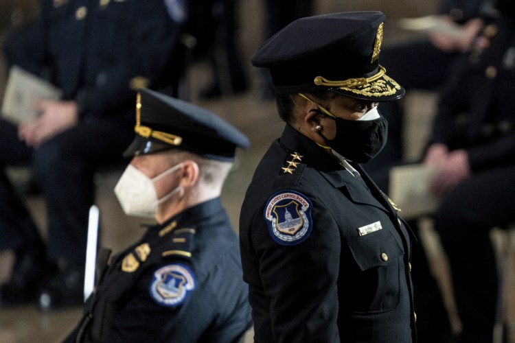 Capitol Police Acting Chief Yogananda Pittman departs a ceremony memorializing U.S. Capitol Police officer Brian Sicknick in the Capitol Rotunda this month in Washington.  Pittman says the department faced “internal challenges” as it responded to the Jan. 6 riot.