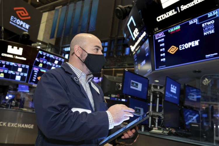 Trader Fred DeMarco works on the trading floor of the New York Stock Exchange on Monday.

