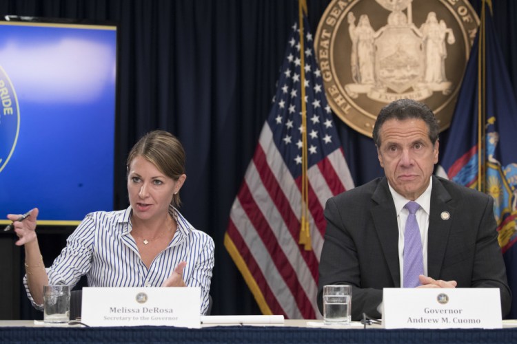 Secretary to the Governor Melissa DeRosa is joined by New York Gov. Andrew Cuomo as she speaks to reporters during a news conference in New York in 2018. De Rosa, Cuomo's top aide, told top Democrats frustrated with the administration's long-delayed release of data about nursing home deaths that the administration "froze" over worries about what information was "going to be used against us," according to a Democratic lawmaker who attended the Wednesday meeting and a partial transcript provided by the governor's office. 