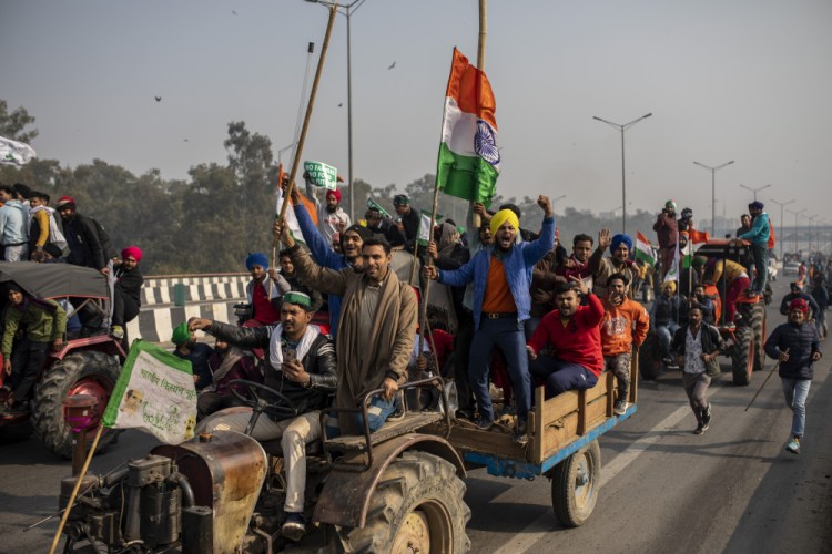Protesting farmers  march to the capital during India's Republic Day celebrations in New Delhi, India, on Jan. 26. Farmers are increasingly worried about their livelihoods under laws they believe would end guaranteed pricing and force them to sell to powerful corporations rather than government-run markets.   