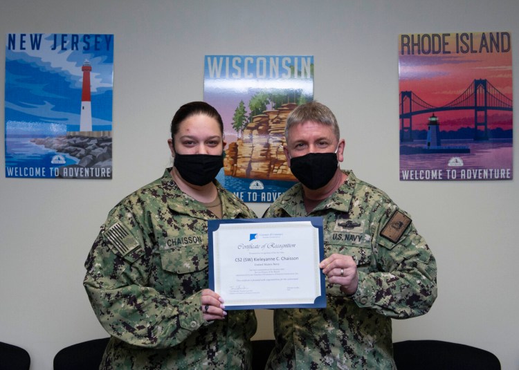 New London Chaplain Cmdr. Jamie Stall-Ryan presents Culinary Specialist 2nd Class Kieleyanne Chaisson with a certificate of recognition from the Chamber of Commerce of Eastern Connecticut for her selection as Service Person of the Month for January.