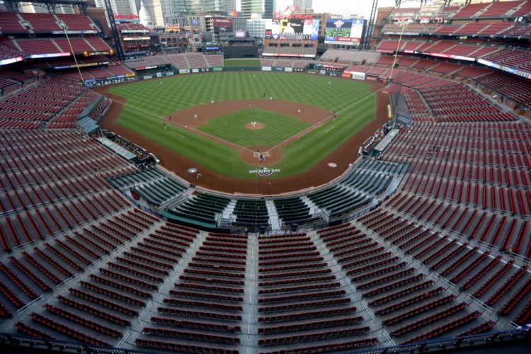 Empty seats are viewed in Busch Stadium as St. Louis Cardinals starting pitcher Jack Flaherty throws in the first inning baseball game against the Pittsburgh Pirates in St. Louis on July 24, 2020. Major League Baseball players rejected a proposal to delay the start of spring training and the season due to the coronavirus pandemic, vowing Monday, Feb. 1, to report under the original schedule. 