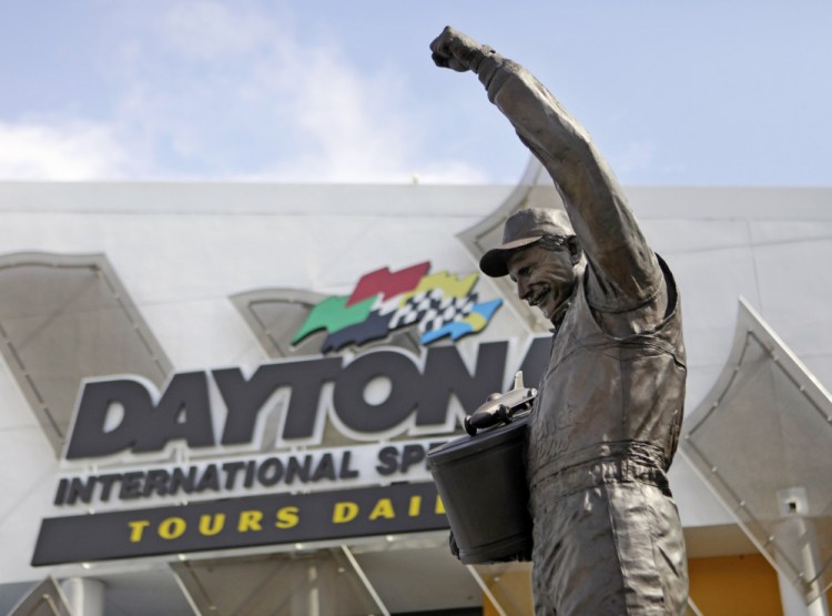 A statue of Dale Earnhardt rises above an entrance at Daytona International Speedway on Feb. 16, 2011 in Daytona Beach, Florida. On the cusp of a national popularity explosion, NASCAR never stopped after the deaths of Adam Petty, Kenny Irwin Jr. and Tony Roper. But losing Earnhardt forced the stock car series to confront safety issues it had been slow to even acknowledge, let alone address. The dramatic upgrades have saved multiple lives — NASCAR has not suffered a racing death in its three national series since — and are the hallmark of Earnhardt's legacy. 