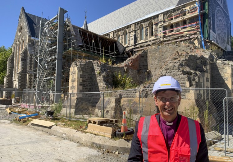 Peter Carrell, the Anglican bishop of Christchurch, stands outside the 2011 earthquake damaged Christ Church Cathedral in central Christchurch, New Zealand on Feb 11.
