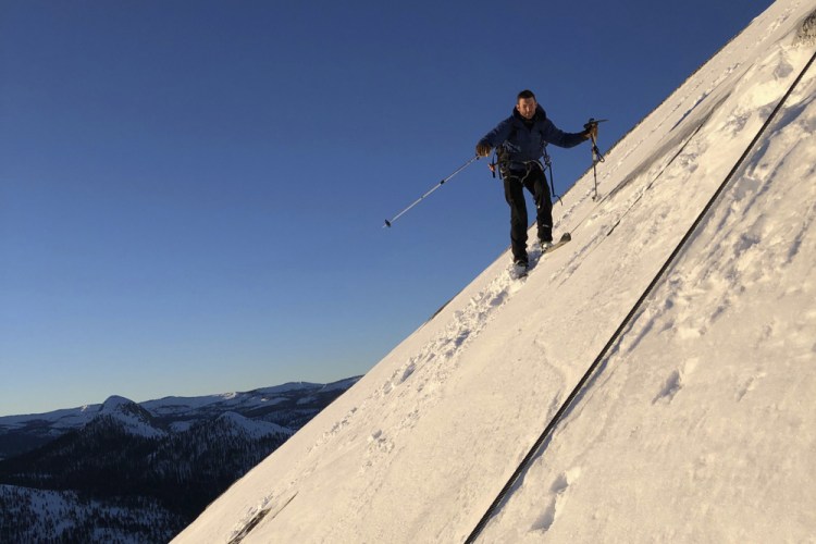 Zach Milligan descends down Half Dome in Yosemite on Feb.  21.


