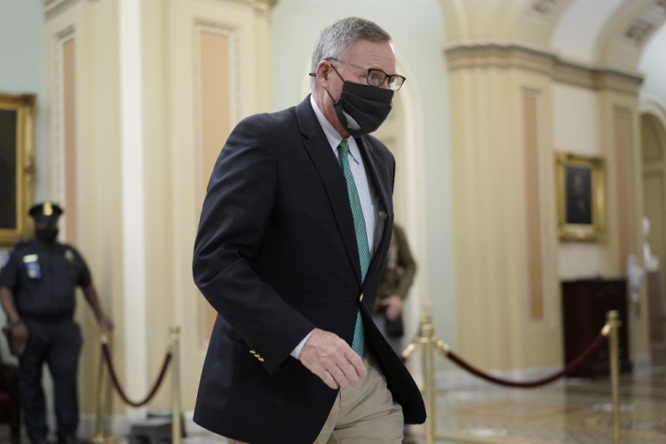 Sen. Richard Burr, R-N.C., walks in the Capitol on Saturday, when the Senate voted 57-43 for the conviction of former President Trump on a charge of incitement to riot. Burr was one of seven Republicans to vote for conviction. 