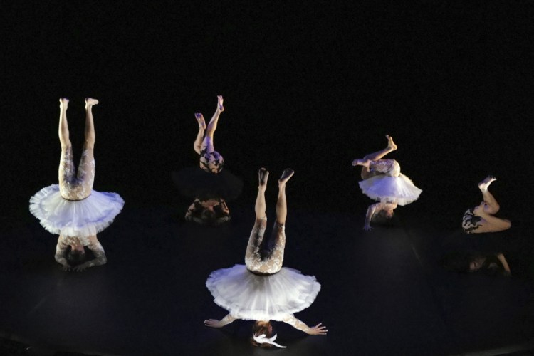 Dancers perform "Le Lac des Cygnes" by Florence Caillon, based on Tchaikovsky's Swan Lake during the BIAC, International Circus Arts Biennale, in Marseille, south of France, on Thursday.

