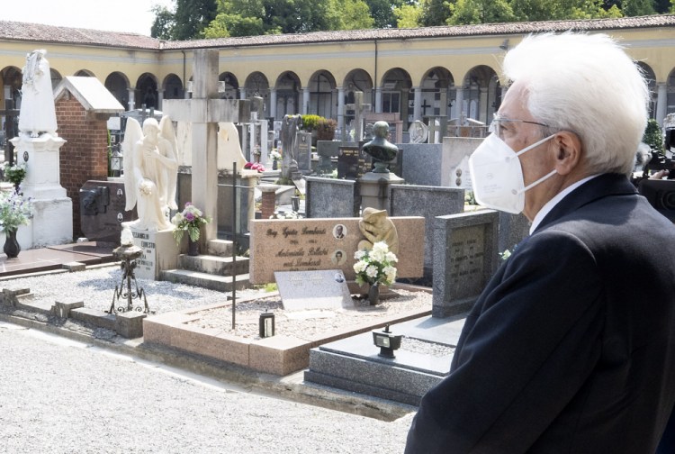 Italian President Sergio Mattarella stands silent June 2 in front of graves at the cemetery of Codogno, Italy, where the first case of COVID-19 emerged. 

