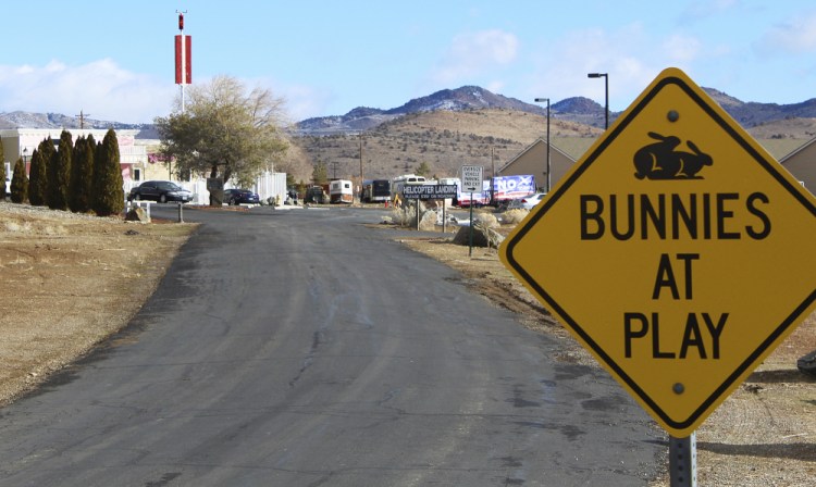The Moonlite Bunny Ranch brothel is seen Feb. 27, 2019, in Lyon County east of Carson City, Nev. For nearly a year, Nevada's legal brothels have been shuttered due to the coronavirus, leaving sex workers trying to pay their bills turning to alternatives like offering "virtual dates" online or non-sexual escort services.