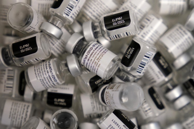 Empty vials of the Pfizer-BioNTech COVID-19 vaccine are seen at a vaccination center in Las Vegas. With virus mutations on the rise, experts are questioning if the vaccine needs to be modified or not. If fully immunized people start getting hospitalized with mutated virus, “that’s when the line gets crossed,” said Dr. Paul Offit, a Children’s Hospital of Philadelphia vaccine expert who advises the FDA. 