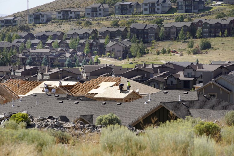 Contractors frame the roof of a home under construction in Park City, Utah, on Aug. 14, 2020. MUST CREDIT: Bloomberg photo by George Frey