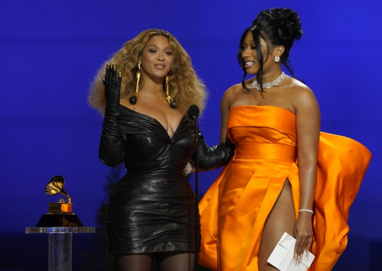Beyonce, left, and Megan Thee Stallion accept the award for best rap song for "Savage" at the 63rd annual Grammy Awards at the Los Angeles Convention Center on Sunday.
