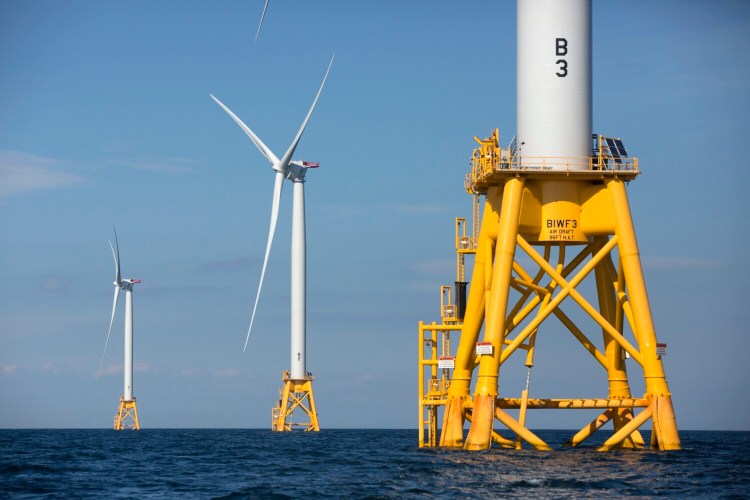 Three of Deepwater Wind's turbines stand in the water off Block Island, R.I., in 2016.  