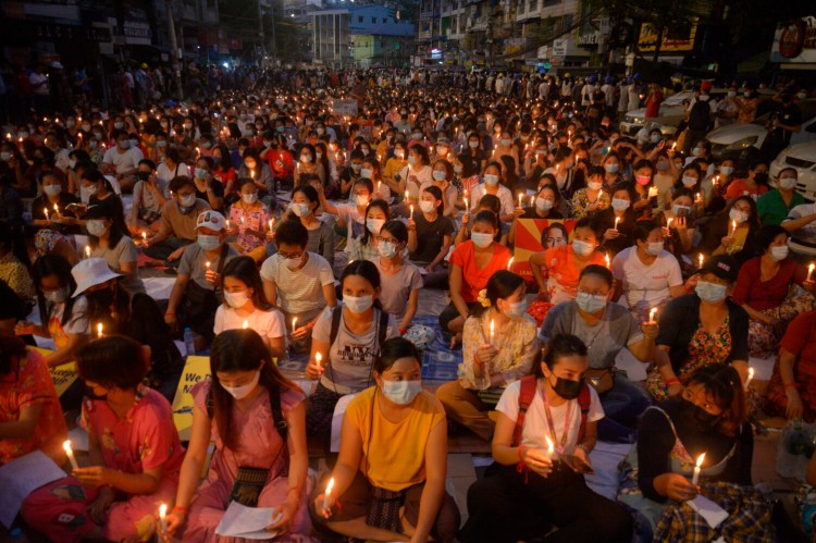 Protesters attend a candlelight rally in Yangon, Myanmar, on Saturday.