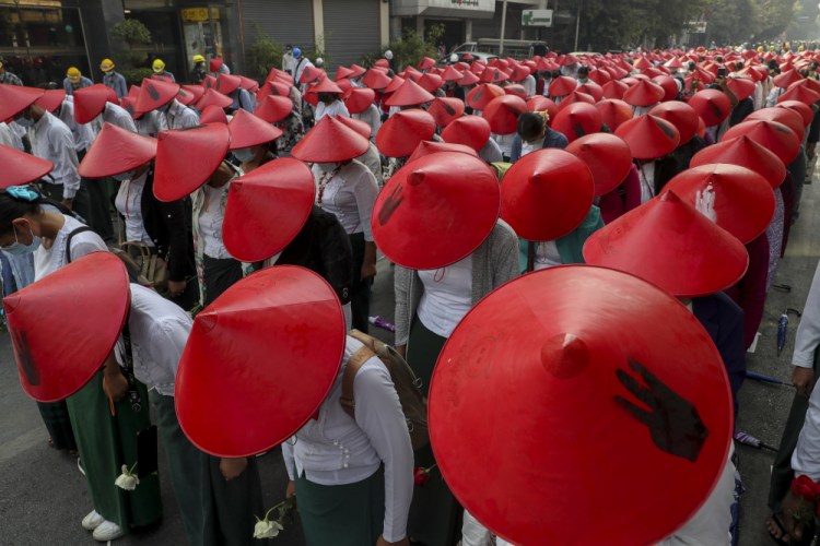 Anti-coup school teachers in their uniform and traditional Myanmar-hats participate in a demonstration in Mandalay, Myanmar, Wednesday, March 3. Demonstrators in Myanmar took to the streets again on Wednesday to protest last month's seizure of power by the military. 