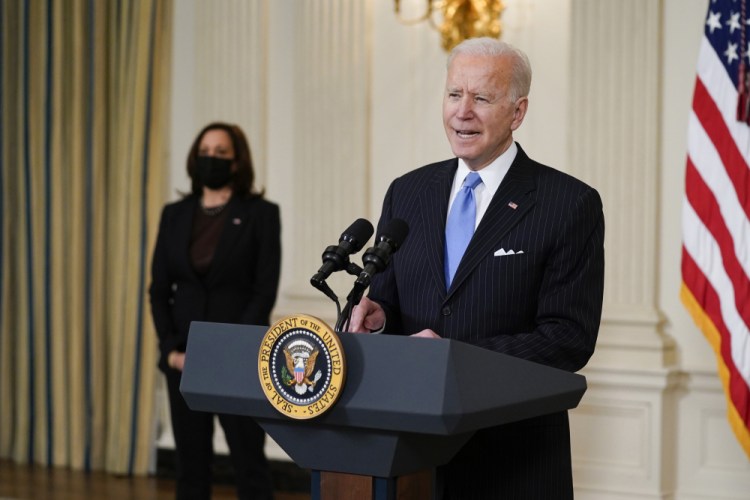 President Joe Biden, accompanied by Vice President Kamala Harris, speaks about efforts to combat COVID-19, in the State Dining Room of the White House, Tuesday, March 2, in Washington. 