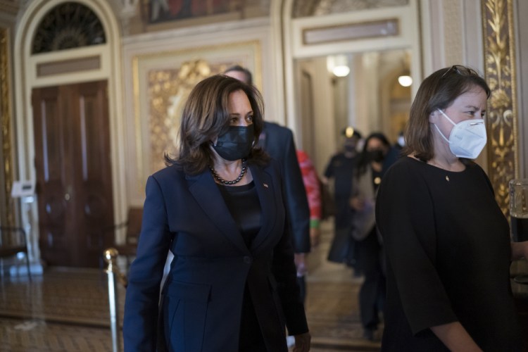 Vice President Kamala Harris arrives to break the tie on a procedural vote as the Senate works on the Democrats' $1.9 trillion COVID relief package Thursday.