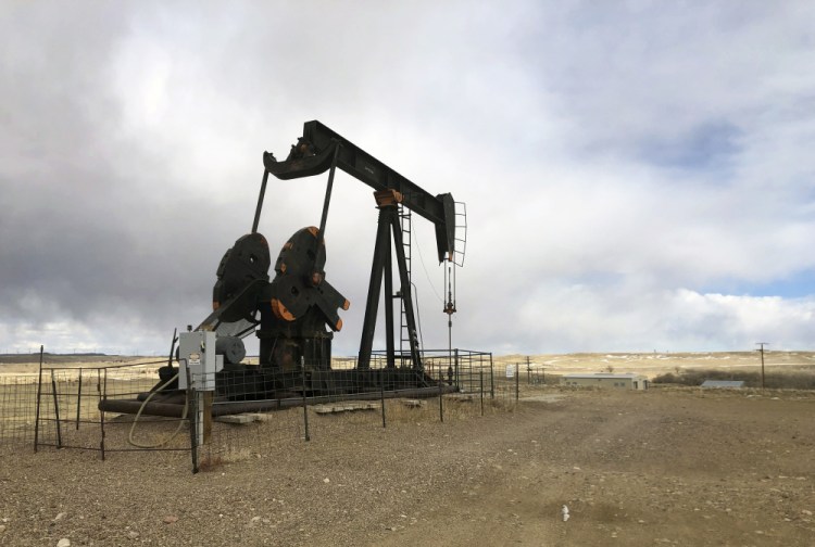 An oil well is seen east of Casper, Wyo., on Feb. 26. President Biden's administration is at odds with the petroleum industry in the Rocky Mountain region and beyond for imposing a moratorium on leasing federal lands for oil and gas production.