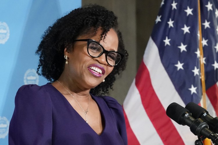 Kim Janey, 55, speaks after being sworn in as Boston's new mayor at City Hall on Wednesday. She said her administration will be open to those who have felt disconnected from the city's power structure.