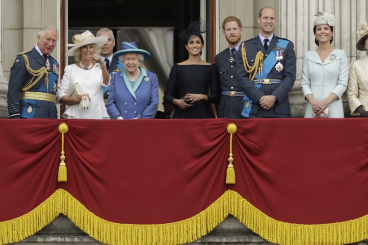 Members of the royal family gather on the balcony of Buckingham Palace in 2018. From left, Britain's Prince Charles, Camilla the Duchess of Cornwall, Prince Andrew, Queen Elizabeth II, Meghan the Duchess of Sussex, Prince Harry, Prince William and Kate the Duchess of Cambridge. The Duke and Duchess of Sussex will finally get the chance to tell the story behind their departure from royal duties directly to the public on Sunday, when their two-hour interview with Oprah Winfrey is broadcast. 
