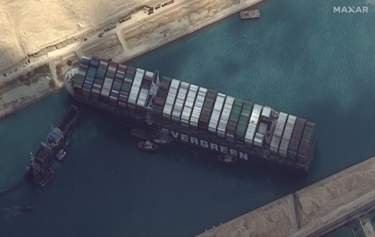 This satellite image from Maxar Technologies shows the cargo ship MV Ever Given stuck in the Suez Canal near Suez, Egypt, on Friday. A maritime traffic jam grew to more than 200 vessels Friday.