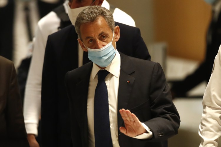 Former French President Nicolas Sarkozy arrives at the courtroom Monday in Paris. 