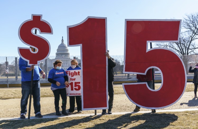 Activists appeal for a $15 minimum wage near the Capitol in Washington on Feb. 25. 
