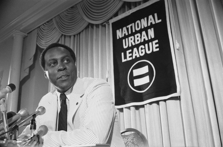 Vernon Jordan, President of the National Urban League, talks to reporters during a press conference in Washington in 1977.  Jordan, who rose from humble beginnings in the segregated South to become a champion of civil rights before reinventing himself as a Washington insider and corporate influencer, died Tuesday. He was 85.