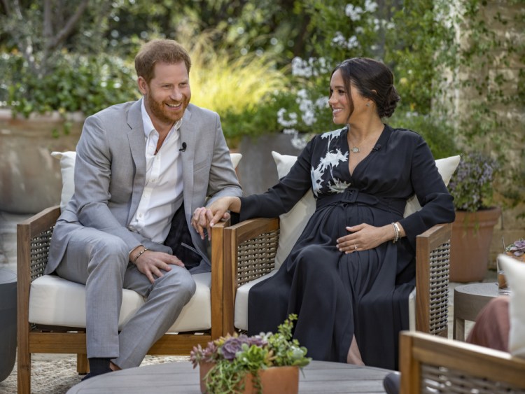 This image provided by Harpo Productions shows Prince Harry and Meghan, Duchess of Sussex, speaking about expecting their second child during an interview with Oprah Winfrey.