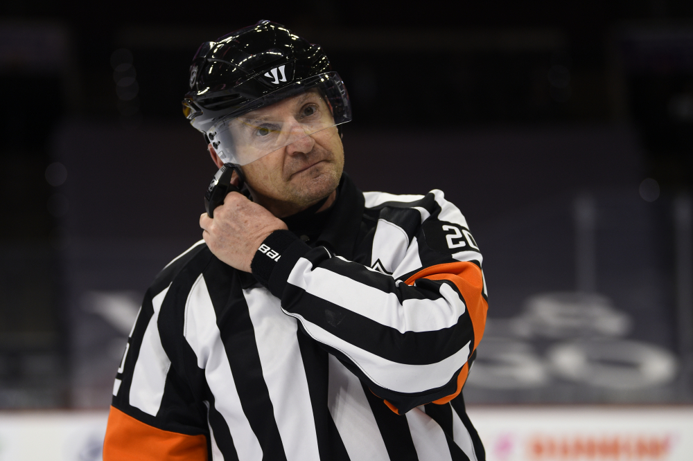 Video: Referee shakes off puck to the face - NBC Sports