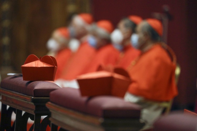 Cardinals sit as Pope Francis celebrates Mass the day after he raised 13 new cardinals to the highest rank in the Catholic hierarchy, at St. Peter's Basilica, Sunday, Nov. 29. Pope Francis has ordered pay cuts for Holy See employees, including slashing cardinals’ salaries by 10%. 