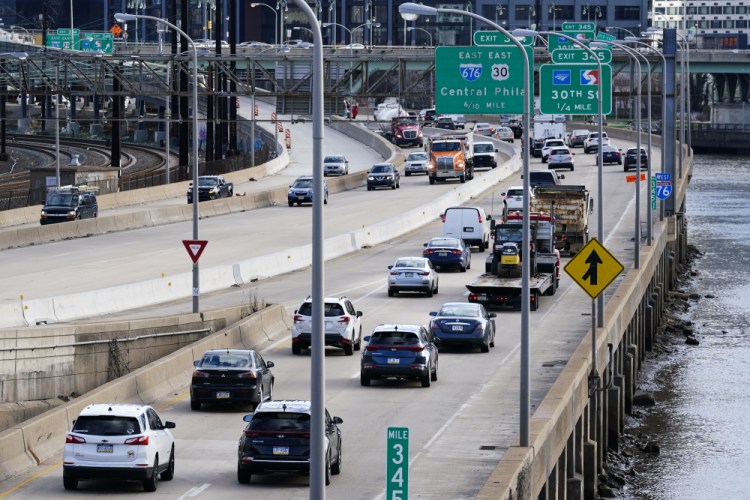 Morning traffic moves along Interstate 76 in Philadelphia, Monday, March 29. U.S. drivers recently reached a major milestone when the number of daily passenger vehicle trips reached pre-pandemic levels for the first time in a year, according to data provided to The Associated Press by the transportation analytics firm Inrix. 