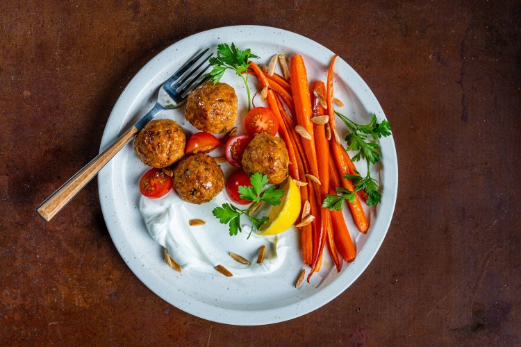 Chicken and Rice Meatballs With Roasted Carrots and Labne. MUST CREDIT: Photo by Rey Lopez for The Washington Post.