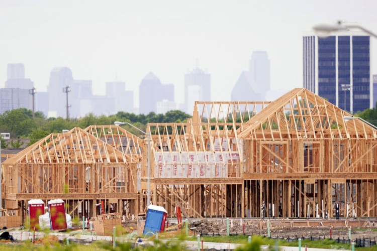 The frame of new home under construction rises n a neighborhood under development in north Dallas last week. The first numbers from the 2020 census show southern and western states gaining congressional seats. 