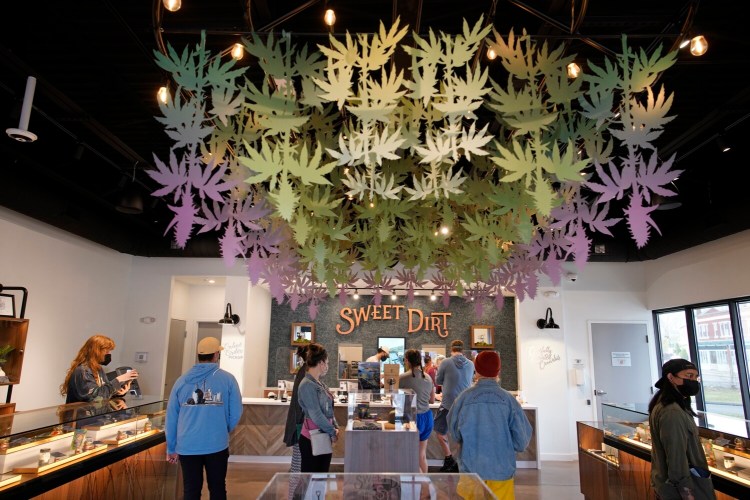 PORTLAND, ME - APRIL 20: People place orders at Sweet Dirt, an adult use cannabis dispensary in Portland, on the first 420 or "weed day" for legal adult use cannabis in Maine. (Staff photo by Gregory Rec/Staff Photographer)