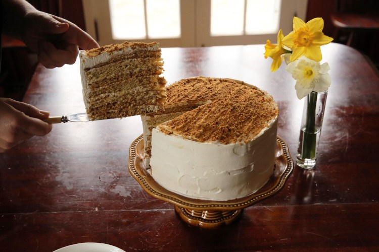 BRUNSWICK, ME - APRIL 22: Christine Burns Rudalevige its a slice of Nine-Layer Russian Honey Cake. (Staff photo by Ben McCanna/Staff Photographer)