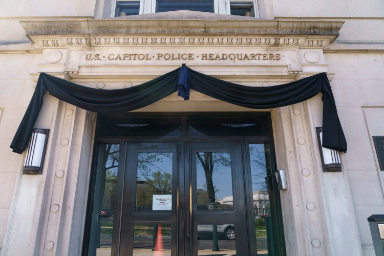 The U.S. Capitol Police Headquarters entrance in Washington, is draped in black Monday, April 5, 2021, after one officer was killed and another injured when a driver slammed into them at a barricade Friday afternoon. Security concerns over the events of the past four months may alter not only how the U.S. Capitol Police operate, but also whether the historically public grounds can remain open. (AP Photo/J. Scott Applewhite)