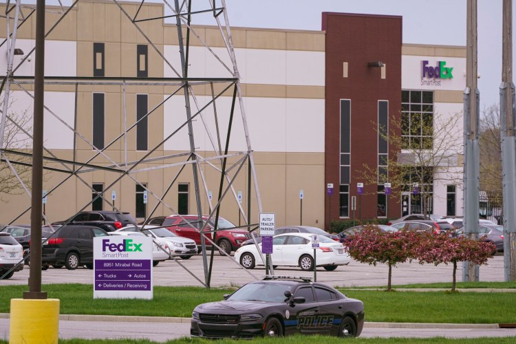 A sheriff's car blocks the entrance to the FedEx facility in Indianapolis. "The risk is, if we move forward with that (red flag) process and lose, we have to give that firearm back to that person," said Marion County Prosecutor Ryan Mears. "That’s not something we were willing to do.”