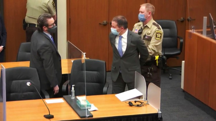 In this image from video, former Minneapolis police officer Derek Chauvin, center, is taken into custody as his attorney, Eric Nelson stands at left, after the verdicts were read at Chauvin's trial for the 2020 death of George Floyd, on April 20 at the Hennepin County Courthouse in Minneapolis, Minn. 