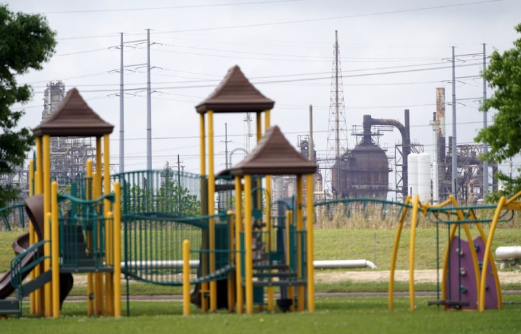 A playground outside the Prince Hall Village Apartments sits empty near one of the petrochemical facilities March 23 in Port Arthur, Texas. 