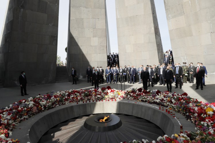 Armenian Prime Minister Nikol Pashinyan, center, attends a memorial service Saturday at the monument to the victims of mass killings by Ottoman Turks, to commemorate the 106th anniversary of the massacre, in Yerevan, Armenia. Armenians marked the anniversary of the death of up to 1.5 million Armenians by Ottoman Turks, an event widely viewed by scholars as genocide, though Turkey refutes the claim.